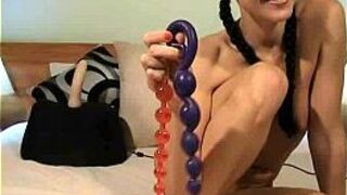 Cute brunette plays with toys - porn video