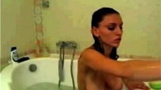 Babe with huge breasts takes bath and teasing - porn video